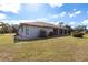 Home's exterior showcasing a well-maintained lawn and stucco exterior at 1147 Yachtsman Ln, Punta Gorda, FL 33983