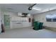 Well-lit garage featuring a utility sink and storage cabinets at 1147 Yachtsman Ln, Punta Gorda, FL 33983