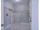 Practical laundry room featuring ample storage shelving, tiled floors, and neutral wall paint at 1147 Yachtsman Ln, Punta Gorda, FL 33983