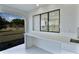 View of screened patio with an outdoor kitchen/wet bar area at 1147 Yachtsman Ln, Punta Gorda, FL 33983