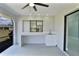 Screened patio with ceiling fan and a wet bar area for entertaining at 1147 Yachtsman Ln, Punta Gorda, FL 33983