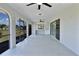 A screened patio features a wet bar, ceiling fans, and views of the backyard at 1147 Yachtsman Ln, Punta Gorda, FL 33983