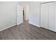 Bedroom with vinyl floors and a spacious closet at 2956 Laurel Ct, Dunedin, FL 34698