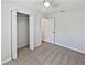 Bedroom boasting cozy carpet and a bi-fold closet at 2956 Laurel Ct, Dunedin, FL 34698