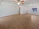 Spacious living room with vinyl floors and a ceiling fan at 2956 Laurel Ct, Dunedin, FL 34698