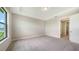 Spacious bedroom with large windows and plush carpeting at 14451 Coastal Woodland Ln, Parrish, FL 34219