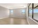 Well-lit bedroom with large windows and a neutral color palette at 14451 Coastal Woodland Ln, Parrish, FL 34219
