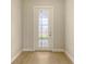 Entryway with tile and glass door and a clear view to the outdoors at 14451 Coastal Woodland Ln, Parrish, FL 34219