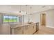 Lovely kitchen with stainless steel appliances and granite countertops at 14451 Coastal Woodland Ln, Parrish, FL 34219