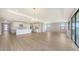 Open concept living space featuring a large kitchen with modern stainless steel appliances at 14451 Coastal Woodland Ln, Parrish, FL 34219