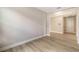 Open floor plan featuring new flooring and neutral walls at 14451 Coastal Woodland Ln, Parrish, FL 34219