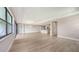 Bright living space with hardwood floors, recessed lighting, and large windows at 14451 Coastal Woodland Ln, Parrish, FL 34219