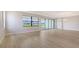 Open living room featuring bright light, hardwood floors and a view of the backyard and patio at 14451 Coastal Woodland Ln, Parrish, FL 34219