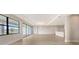 Spacious living room with hardwood floors and sliding glass doors offering backyard views at 14451 Coastal Woodland Ln, Parrish, FL 34219