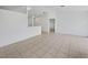 Bright, neutral living room featuring tile floors and an open floor plan at 3593 Junction St, North Port, FL 34288