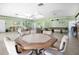 Spacious community clubhouse with a game table, multiple seating areas, and a pool table for residents at 11511 113Th St # 13F, Seminole, FL 33778