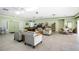Community clubhouse with a seating area, pool table, and bookshelves with a variety of reading materials at 11511 113Th St # 13F, Seminole, FL 33778