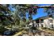 Condo building exterior with a view of the canal surrounded by lush green foliage at 11511 113Th St # 13F, Seminole, FL 33778