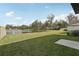 Green backyard with a lake view with a fence and plenty of space to relax at 2318 E Newsome Rd, Plant City, FL 33565