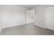 Cozy bedroom featuring neutral walls and plush carpet with an open doorway and a built-in closet at 2318 E Newsome Rd, Plant City, FL 33565
