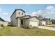 Lovely two-story home with a manicured lawn and an attached two-car garage at 2318 E Newsome Rd, Plant City, FL 33565