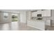 Open concept living area with granite countertops, tile floors and lake views at 2318 E Newsome Rd, Plant City, FL 33565