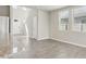 Open living area with tile floors, lots of natural light, and stainless steel appliances at 2318 E Newsome Rd, Plant City, FL 33565