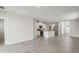 Spacious living room and open kitchen with stainless steel appliances and tile flooring at 2318 E Newsome Rd, Plant City, FL 33565