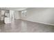 Large open living space with light gray tile flooring and lots of natural light at 2318 E Newsome Rd, Plant City, FL 33565