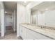 Bright bathroom features double vanity with granite countertops at 3912 Radiant Mountain Dr, Plant City, FL 33565