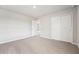Bedroom featuring carpet and closets with white trim at 3912 Radiant Mountain Dr, Plant City, FL 33565