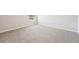 Bright bedroom featuring neutral-toned carpet and a window at 3912 Radiant Mountain Dr, Plant City, FL 33565