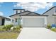 Charming two-story home featuring a two-car garage, and attractive landscaping at 3912 Radiant Mountain Dr, Plant City, FL 33565