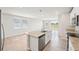 Bright kitchen featuring an island with stainless steel appliances, granite countertops at 3912 Radiant Mountain Dr, Plant City, FL 33565