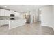 Bright, open kitchen features modern stainless steel appliances, granite countertops, and ample cabinet space at 3912 Radiant Mountain Dr, Plant City, FL 33565