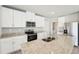 Well-equipped kitchen features a large island, granite countertops, and stainless steel appliances at 3912 Radiant Mountain Dr, Plant City, FL 33565
