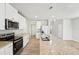 Modern kitchen with granite counters, stainless appliances, and a center island at 3912 Radiant Mountain Dr, Plant City, FL 33565