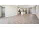 Open-concept living space featuring tile flooring, a kitchen with an island, and abundant natural light at 3912 Radiant Mountain Dr, Plant City, FL 33565