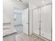 Bathroom featuring tile flooring, double sink vanity and walk-in shower at 225 Lazy Shore Dr, Nokomis, FL 34275