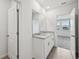 A bathroom featuring double sinks, granite countertops, and a large mirror at 225 Lazy Shore Dr, Nokomis, FL 34275