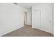 An airy bedroom with a neutral color palette and a closet for storage at 225 Lazy Shore Dr, Nokomis, FL 34275