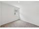 A cozy bedroom with a single window and neutral carpeting at 225 Lazy Shore Dr, Nokomis, FL 34275