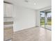 A dining room features access to an outdoor area through sliding glass doors at 225 Lazy Shore Dr, Nokomis, FL 34275