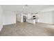 Open-concept living space with tile floors adjoins the kitchen at 225 Lazy Shore Dr, Nokomis, FL 34275