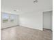 Open-concept living space with tile floors and natural lighting at 225 Lazy Shore Dr, Nokomis, FL 34275