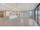 Bright great room featuring hard flooring and an eat-in kitchen with stainless steel appliances at 14517 Coastal Woodland Ln, Parrish, FL 34219