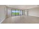 Spacious living room with sliding glass doors that provide backyard views at 14517 Coastal Woodland Ln, Parrish, FL 34219