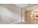 Open-concept living room and kitchen, with light-colored hard flooring at 14517 Coastal Woodland Ln, Parrish, FL 34219