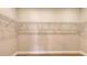 Empty walk-in closet featuring metal racks for storage at 14517 Coastal Woodland Ln, Parrish, FL 34219