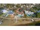 Waterfront home boasts a private pool, mature landscaping, and a dock with direct access to the open bay at 103 Shore Dr, Dunedin, FL 34698